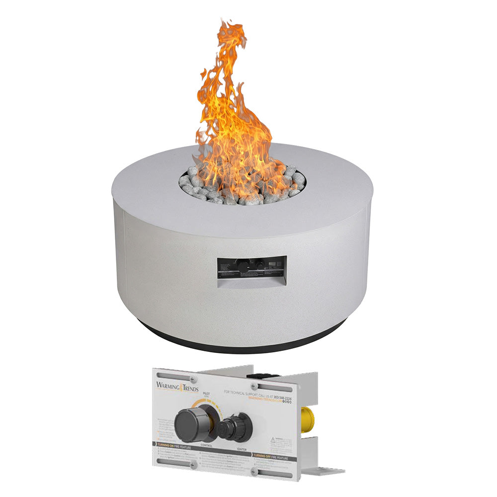Round gas fire table with open orange flame and gray lava stones in a light gray enclosure