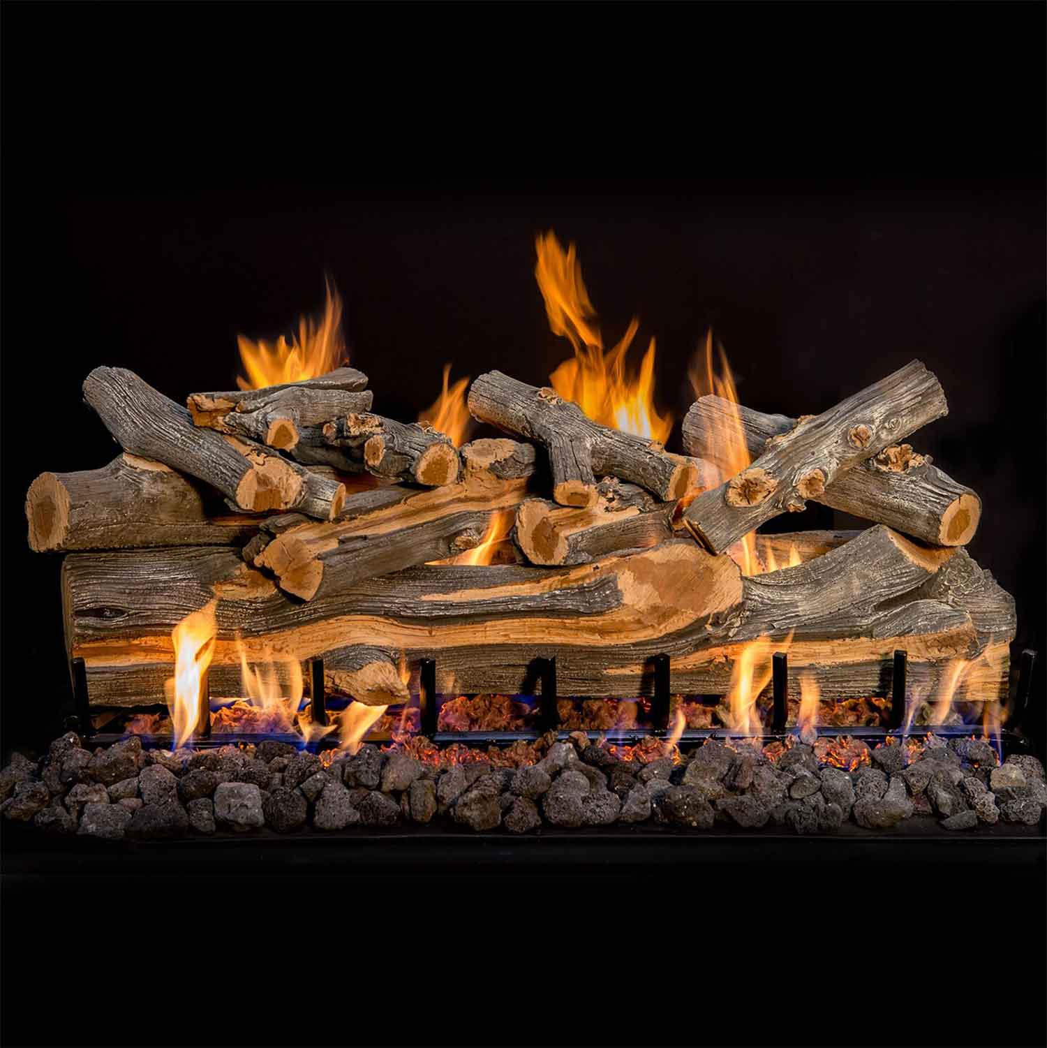 Vented gas log set with multiple logs across a metal grate, flames rising