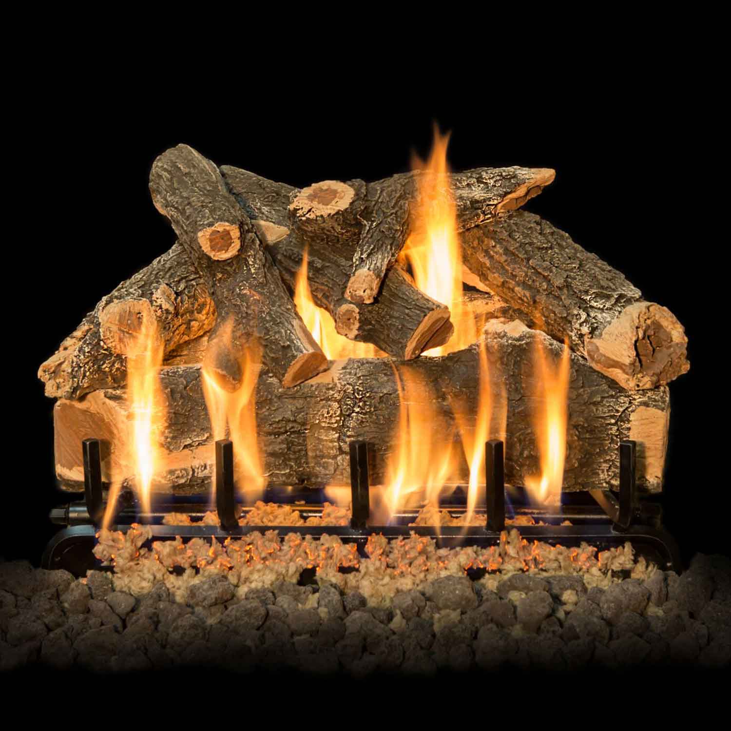 Double-sided gas logs with weathered oak pieces, glowing flames over rock bed