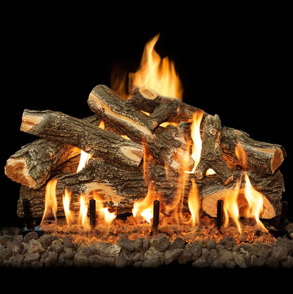 Stacked charred logs on vented burner grate with tall, glowing flames