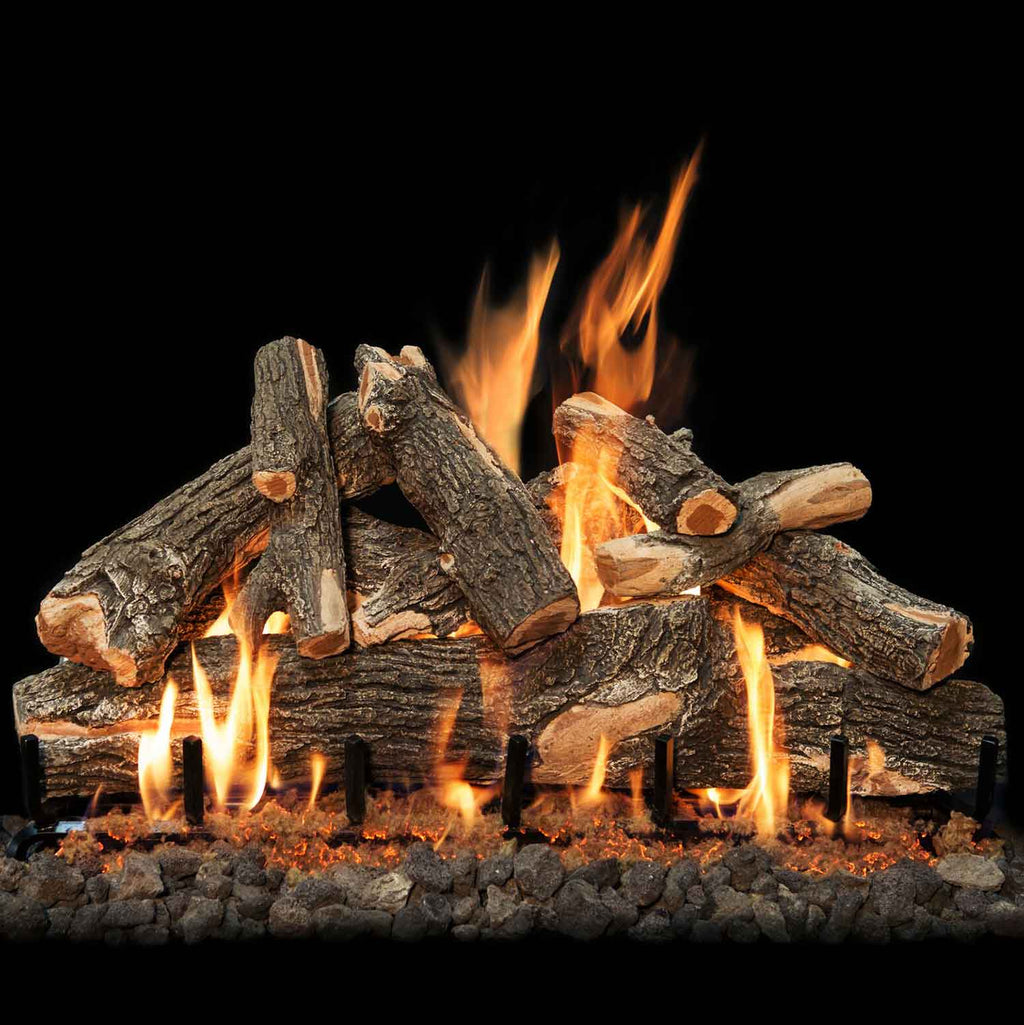 Weathered oak double-sided gas log set with bright flames and rocky base
