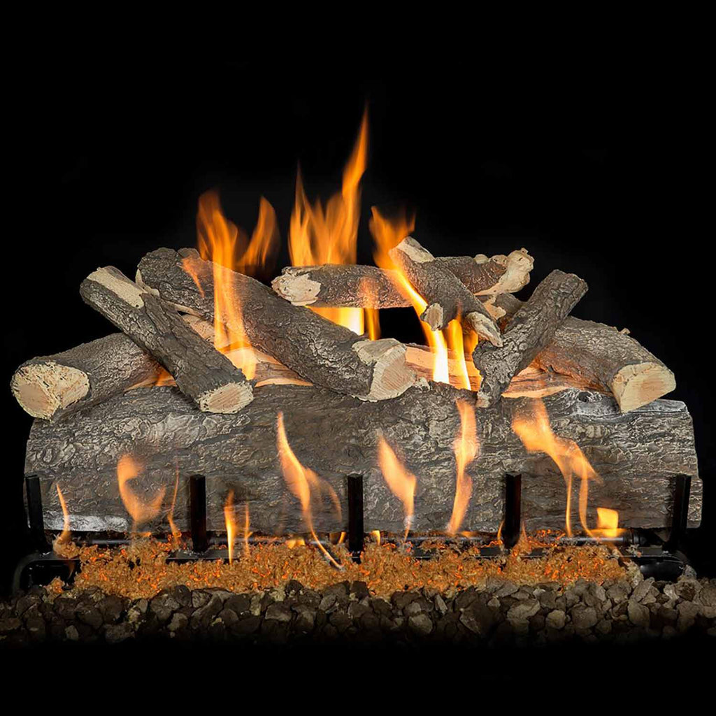 Gas log set with split logs over stone embers, orange flames and black grate bars