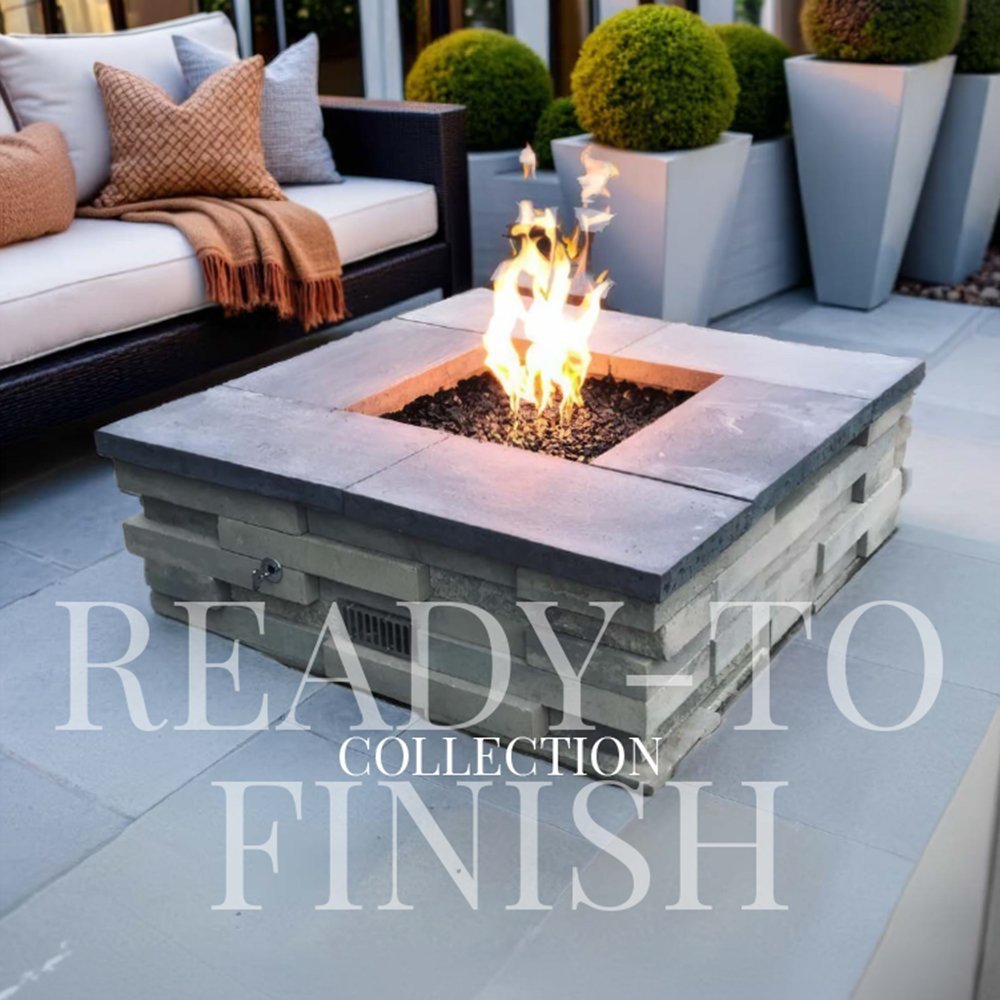 Square fire pit enclosure with active flames and burner bed inside a concrete surround