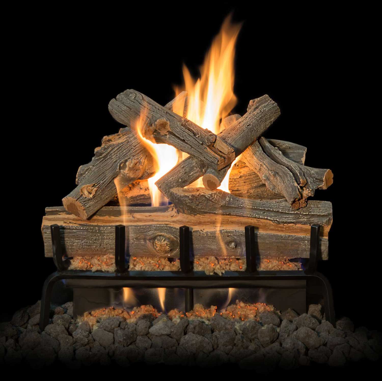 Vented gas log set with gray logs, stainless burner grate, and bright orange flames