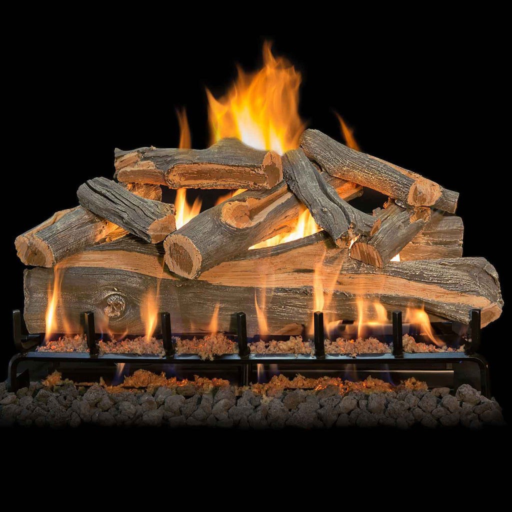 Vented gas log set with stacked wood logs, stainless burner, and flames