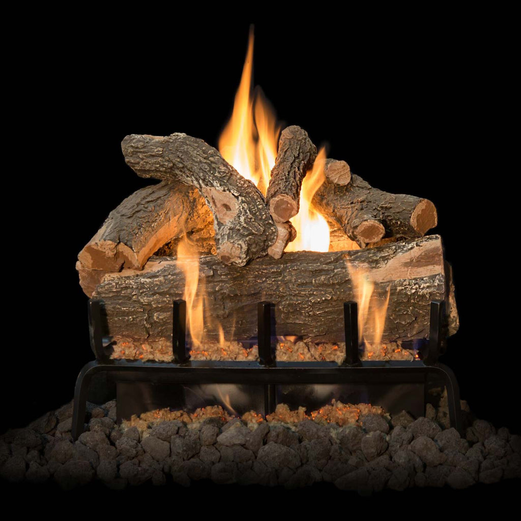 Weathered oak gas log set with tall flames behind black metal grate and scattered lava rocks