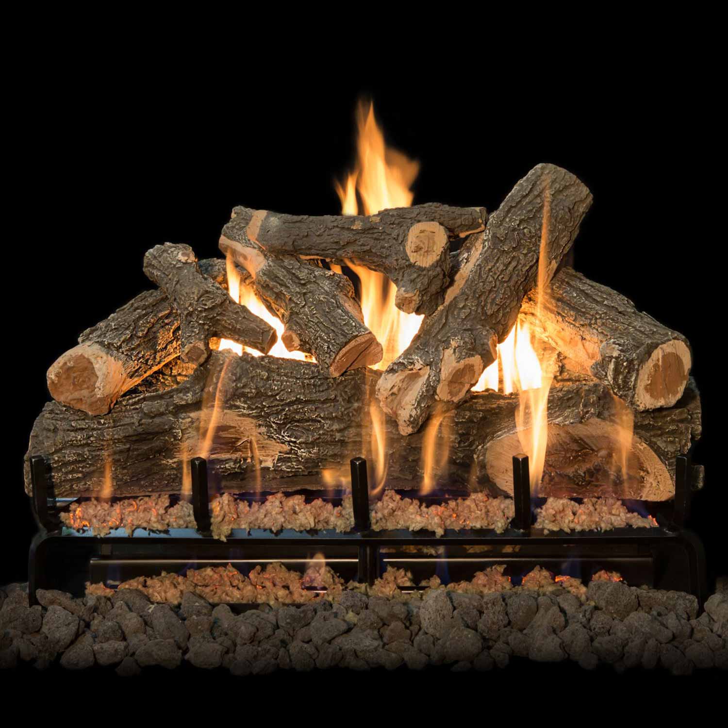 Weathered oak gas log set showing flames rising through black burner grate and dark lava rocks