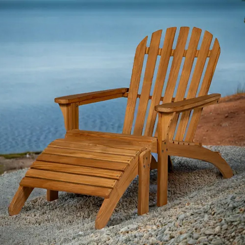 Solid teak adirondack chair with slatted seat and back, armrests, natural wood finish