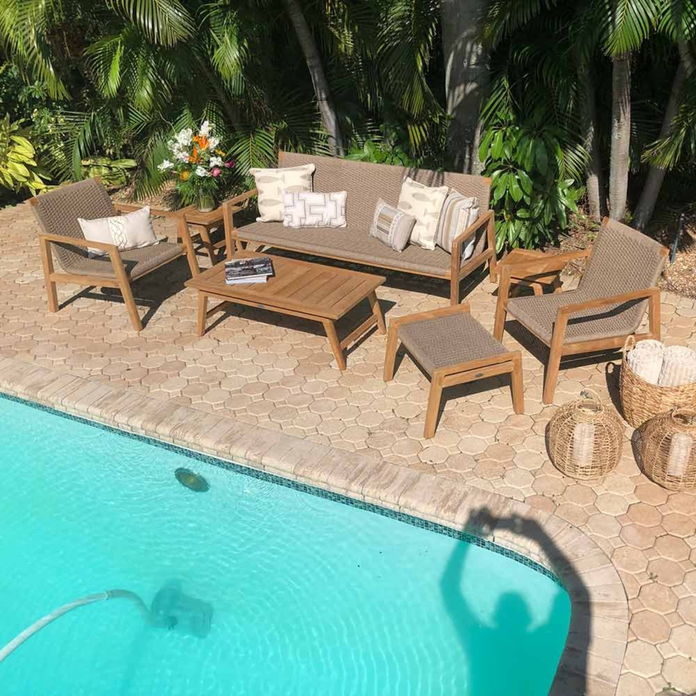 Charcoal cushioned patio seating set with sofa, chairs, and square teak coffee table