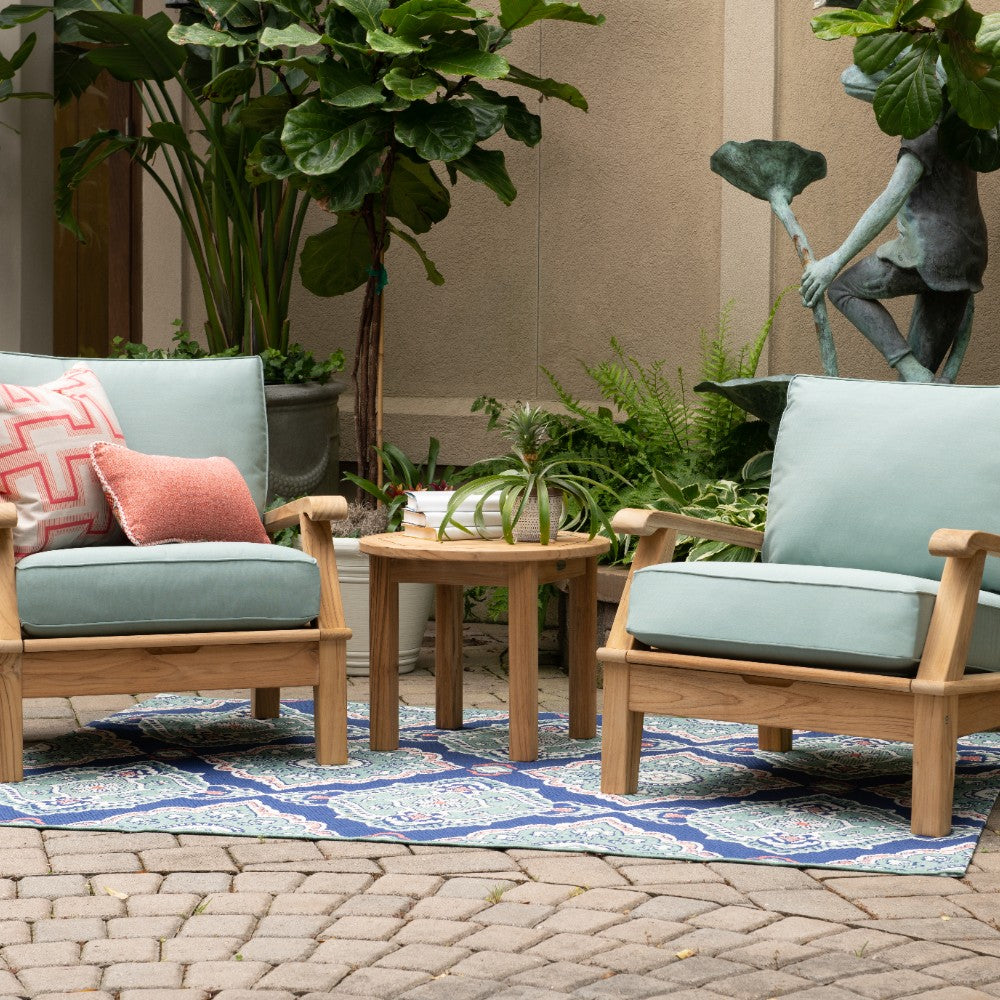 Round wooden side table with slatted teak top and four tapered legs