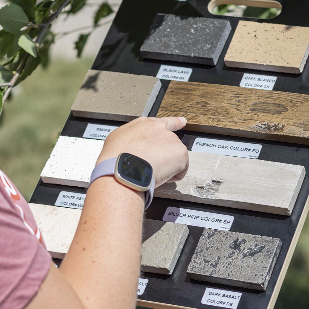 American Fyre Designs color sample board with hand selecting labeled wood and stone swatch