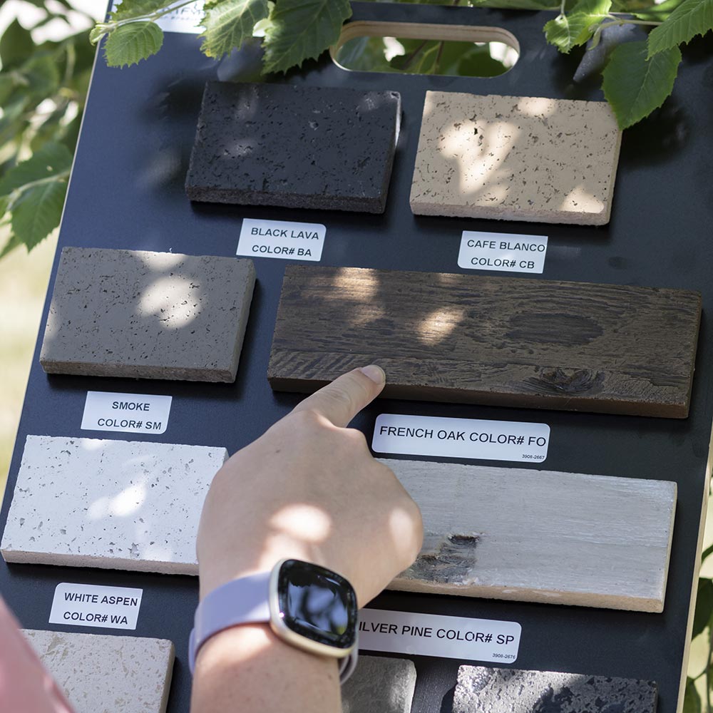 American Fyre Designs color sample board with finger pointing at labeled finish swatch