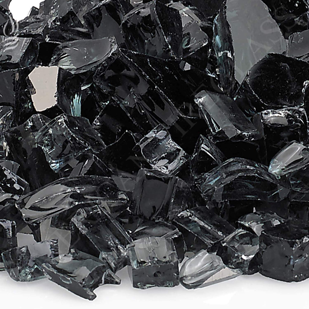 Black reflective fire glass, glossy shards and cube-like pieces close-up