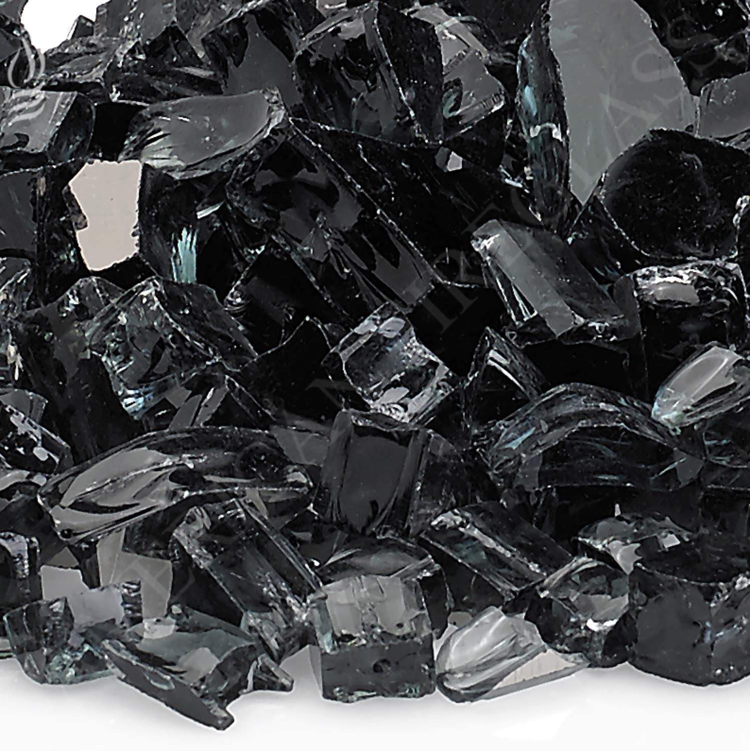Black reflective fire glass, glossy shards and cube-like pieces close-up