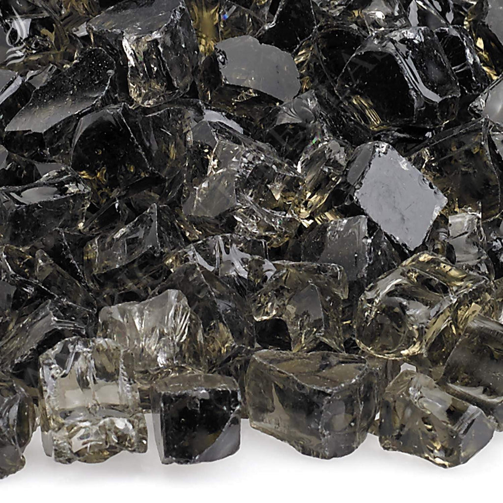 Close-up fire glass chunks with dark gray, clear, and bronze shimmer