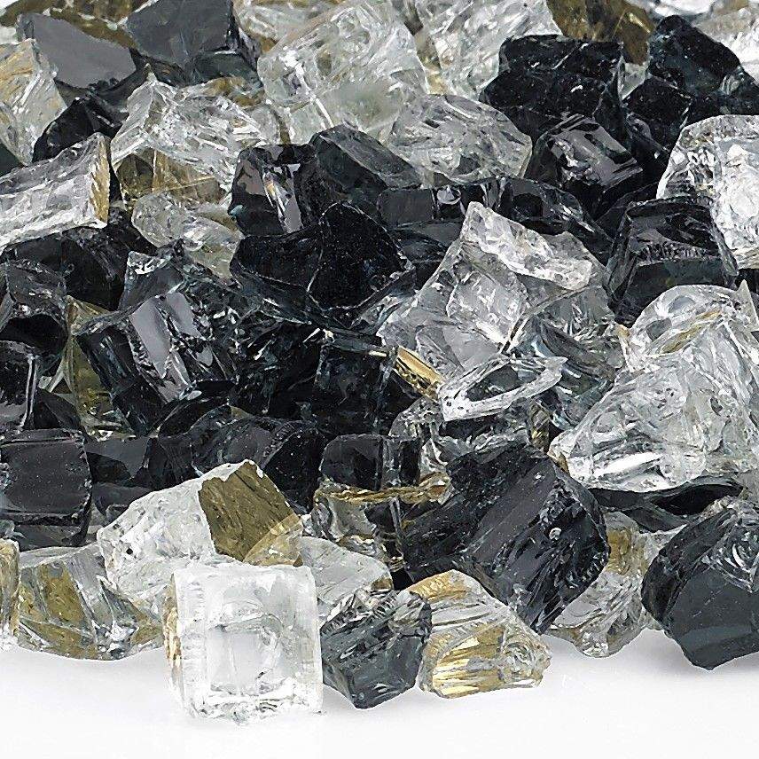 Close-up reflective fire glass shards in black, clear, and gold tones