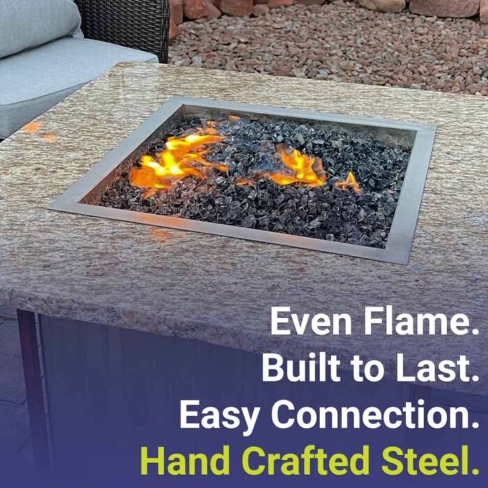 Square fire pit burner pan installed with visible flames over black lava rock