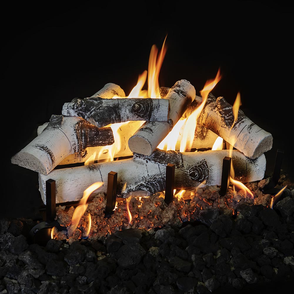 Double-sided gas log set with charred gray-white logs and flames above black coals