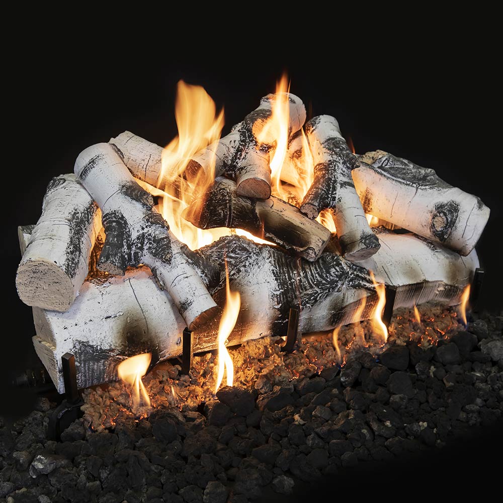 Double-sided gas log set with gray-white logs and open flames over black rocks