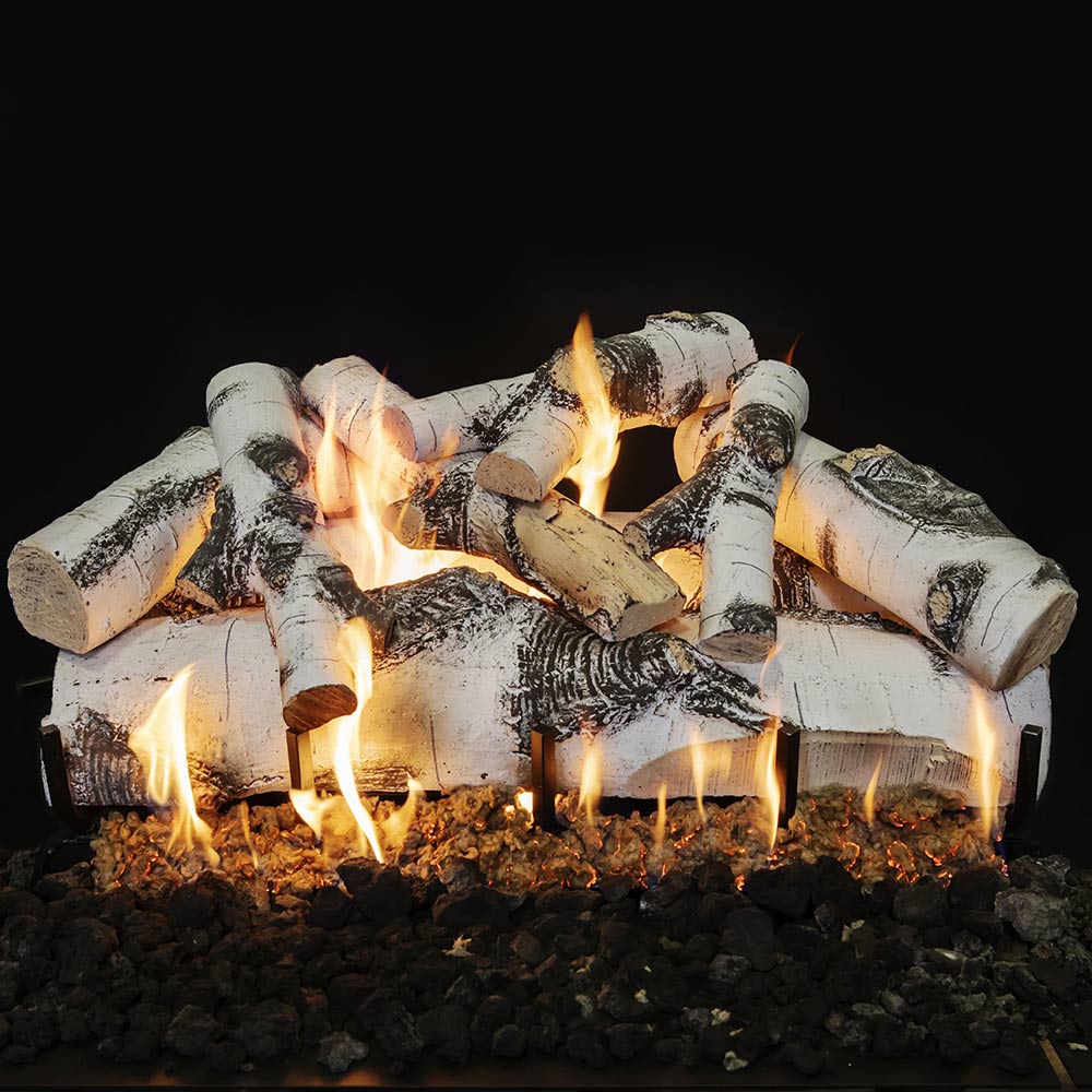Double-sided vented gas log set with white faux logs, orange flames, and black stones