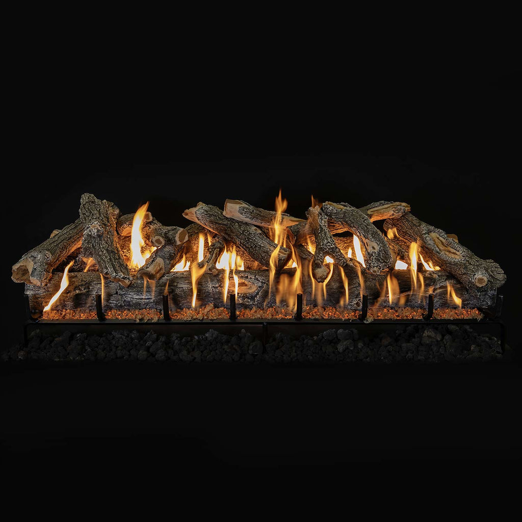 Vented gas log set with weathered oak logs on burner grate, flames across front