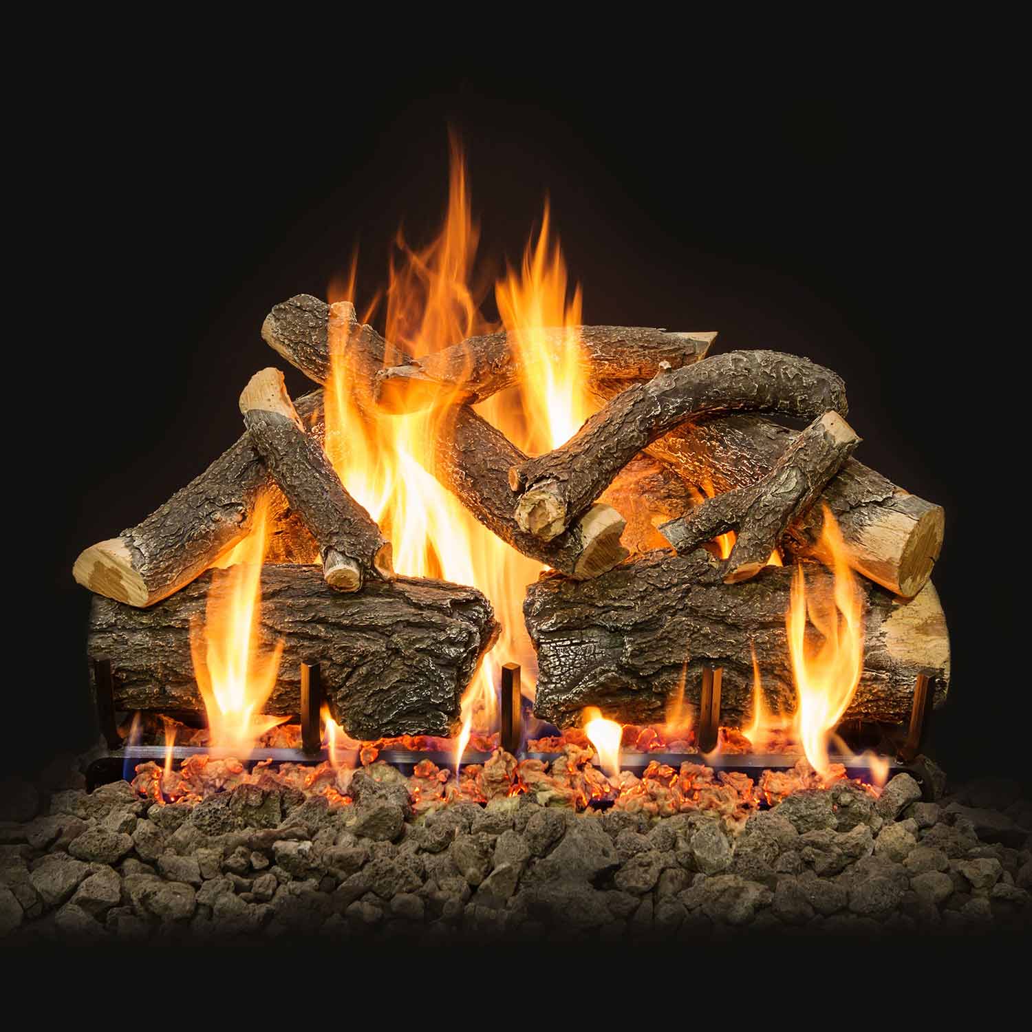 Burning vented gas logs with tall flames and ember bed stones