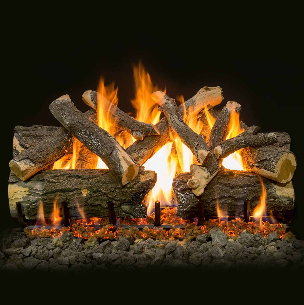 Burning vented gas logs with multiple flames and charred wood pieces