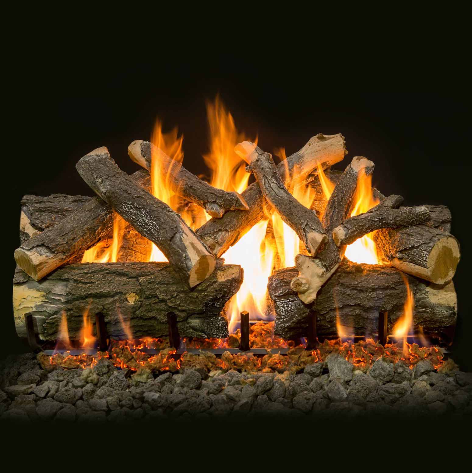 Burning vented gas logs with multiple flames and charred wood pieces