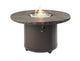 Stone-brown fire pit table with open flame in round top and dark base