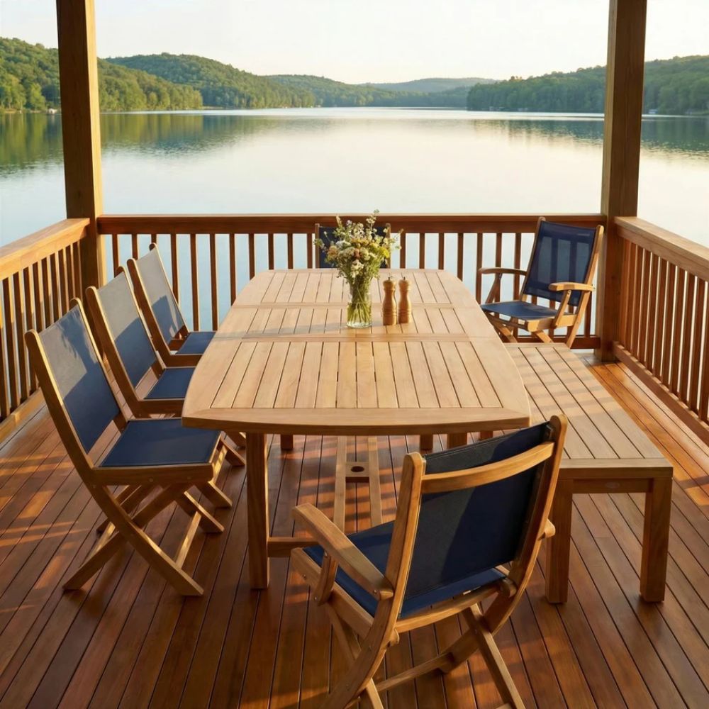 Solid teak dining bench with rectangular top and tapered legs on a deck