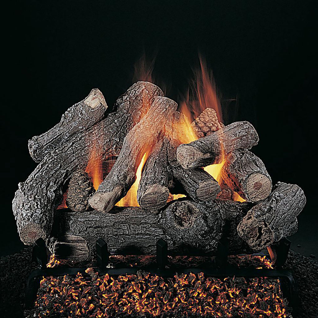 Burning gas fire logs with faux charcoal wood pieces and glowing flames