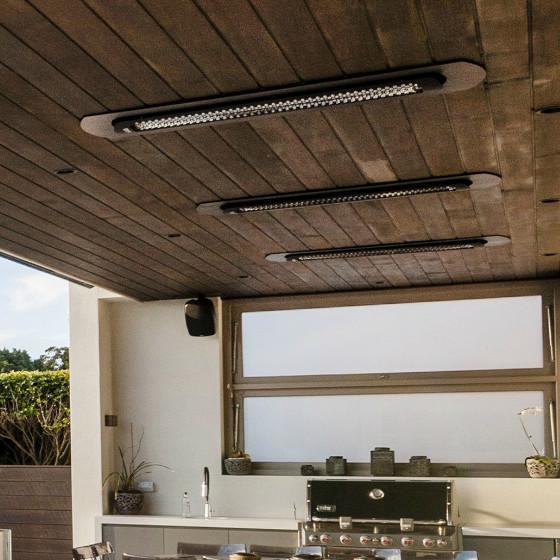 Installed ceiling recess heater housings on wood soffit, dark finish