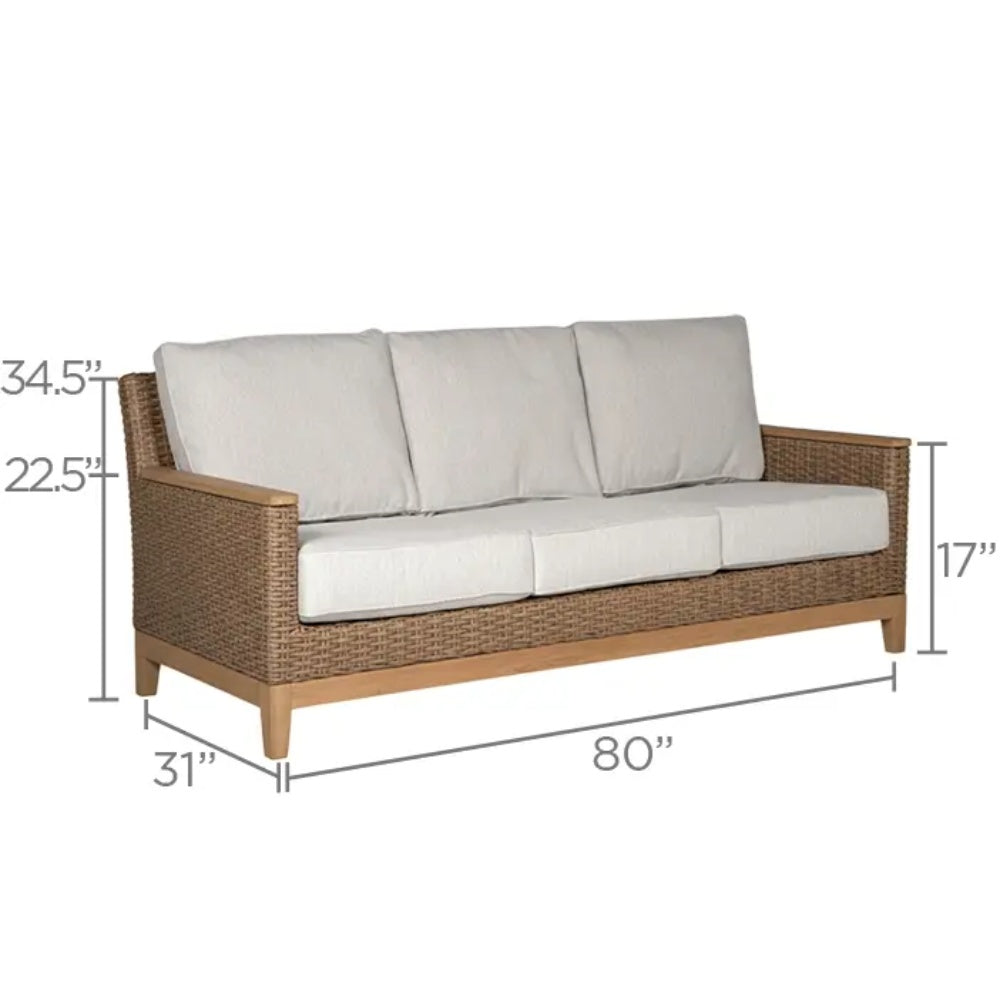 Loveseat with dark wicker frame and light cushions, including seat and back pillows