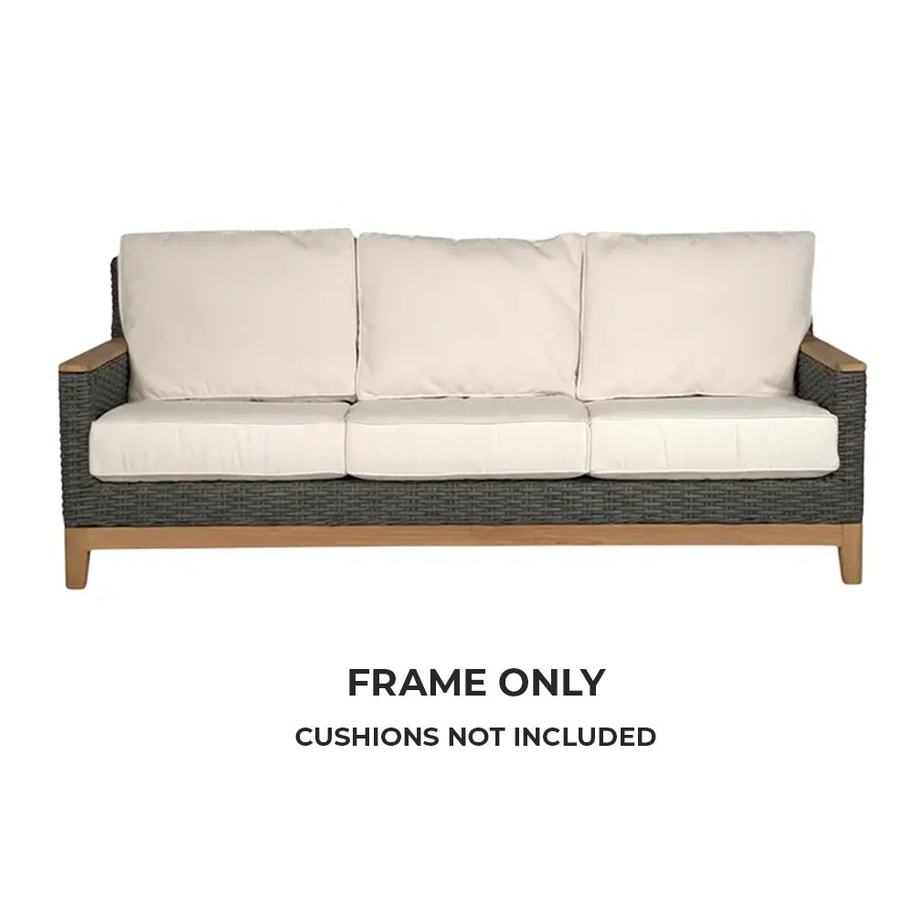 Outdoor sofa with charcoal wicker base and three white back cushions