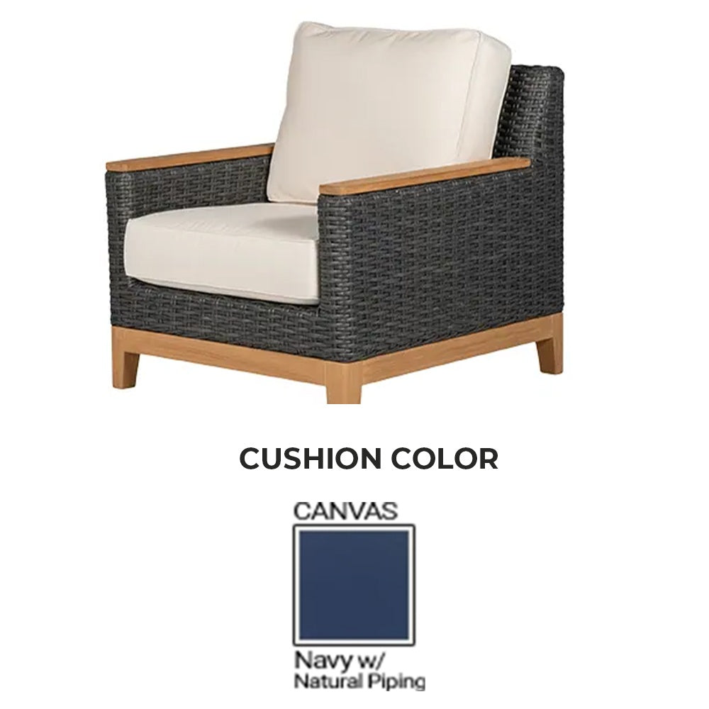 Club chair with woven charcoal frame and canvas navy cushions with natural piping