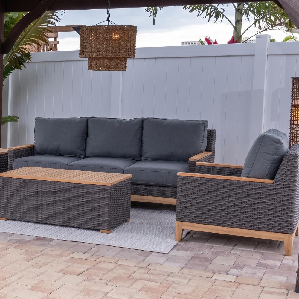 Charcoal woven lounge chair with dark gray seat and back cushions and wood base