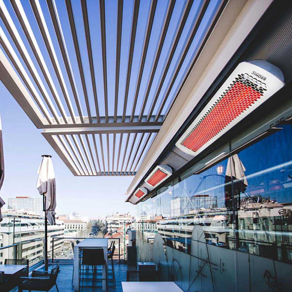 Wall-mounted electric heater with white housing and red heating element under a canopy