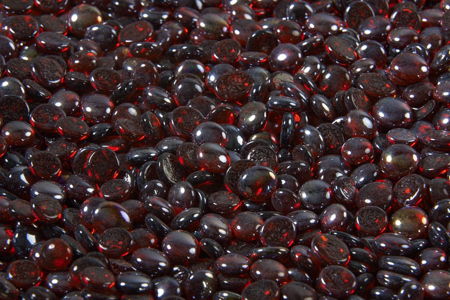 Ruby fire glass gems, red and dark purple glass beads packed together