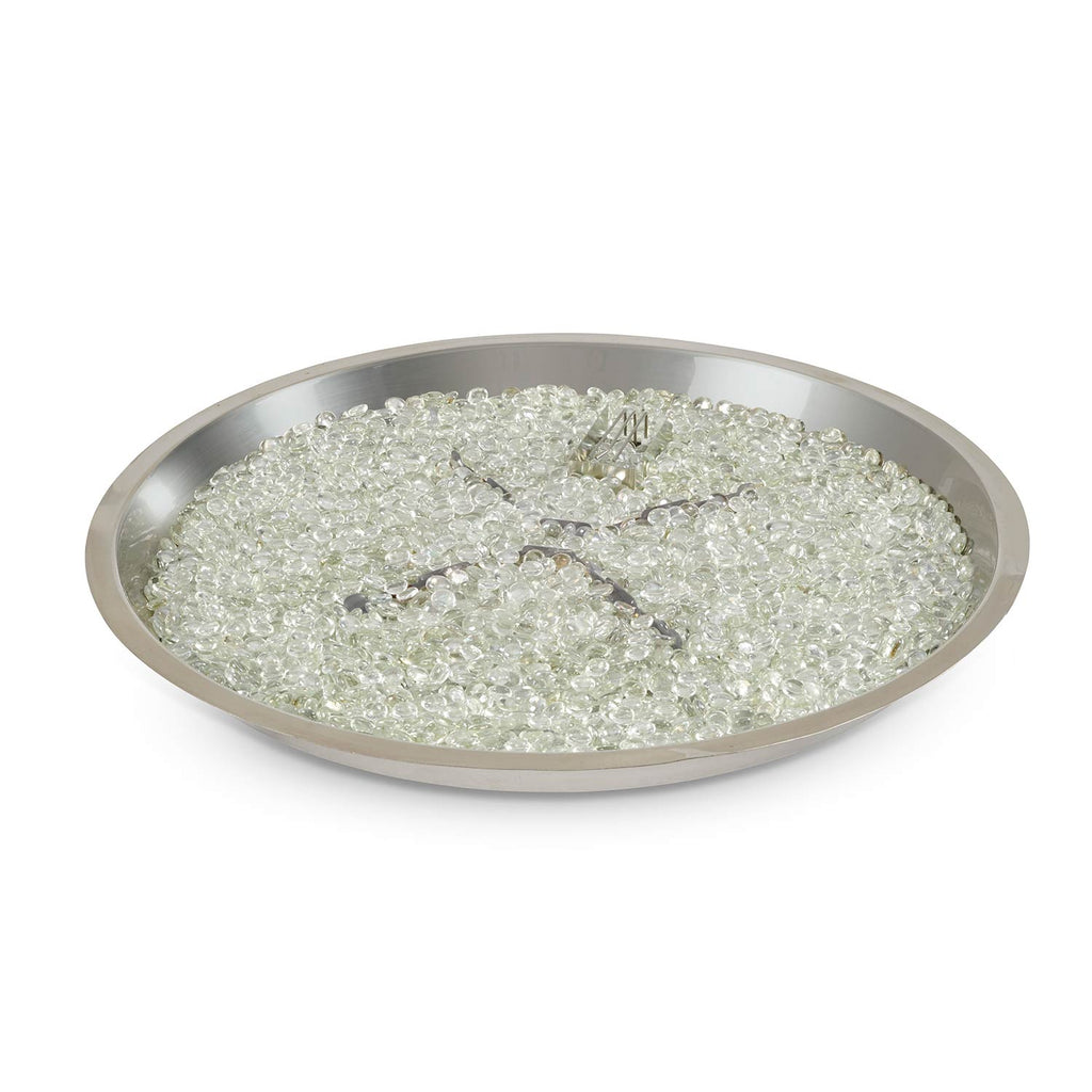 Round metal fire pit bowl pan filled with clear glass fire media and cross burner