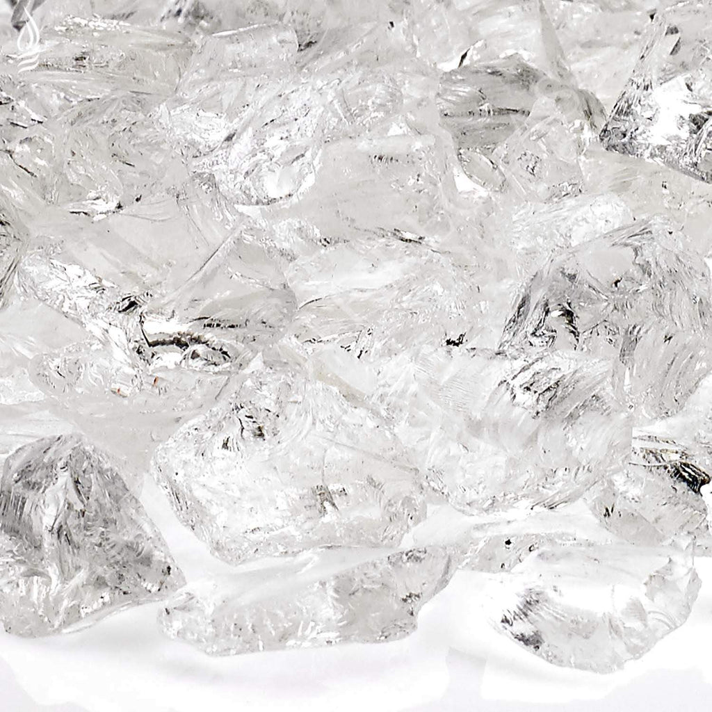 Close-up of ice-white recycled fire glass shards with reflective surfaces and dark specks