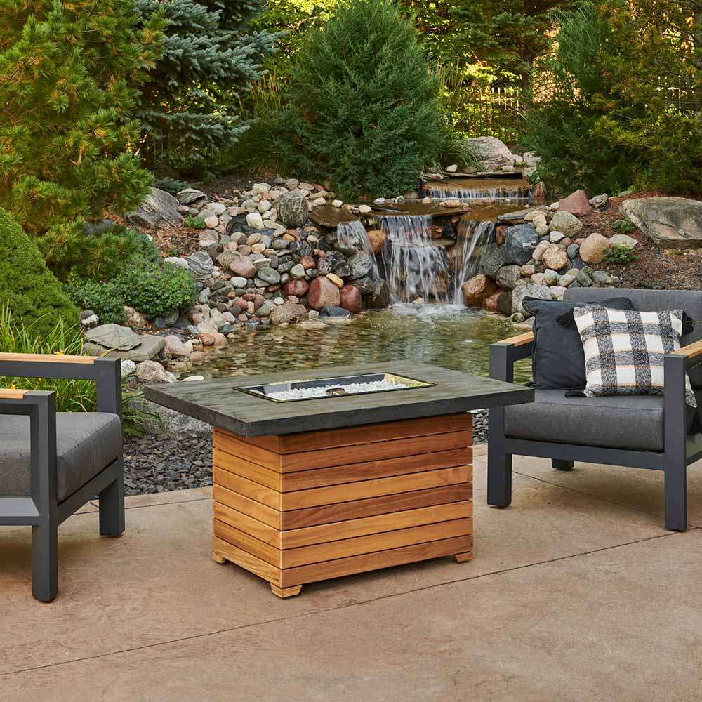 The Outdoor GreatRoom Company DAR-1224-EBG Darien Gas Fire Pit Table with Everblend Top and Teak Base, 44x30-Inch