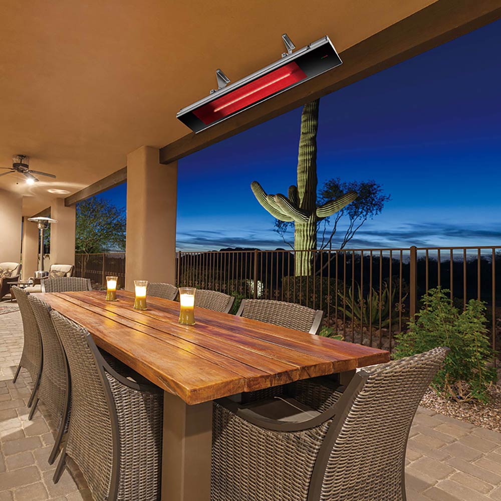 Infrared electric heater ceiling mounted above patio with red glowing element