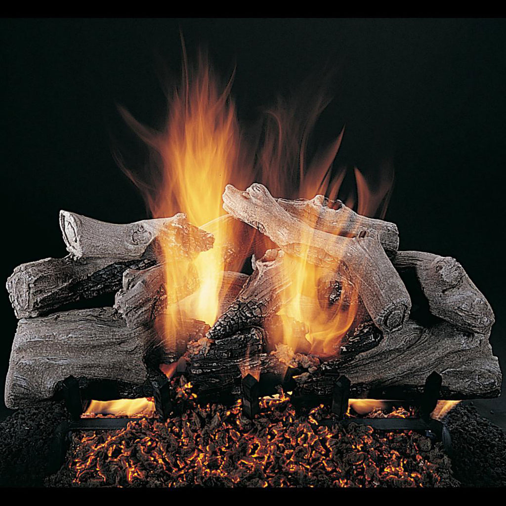 Double-sided gas log set with several gray logs and bright orange flames