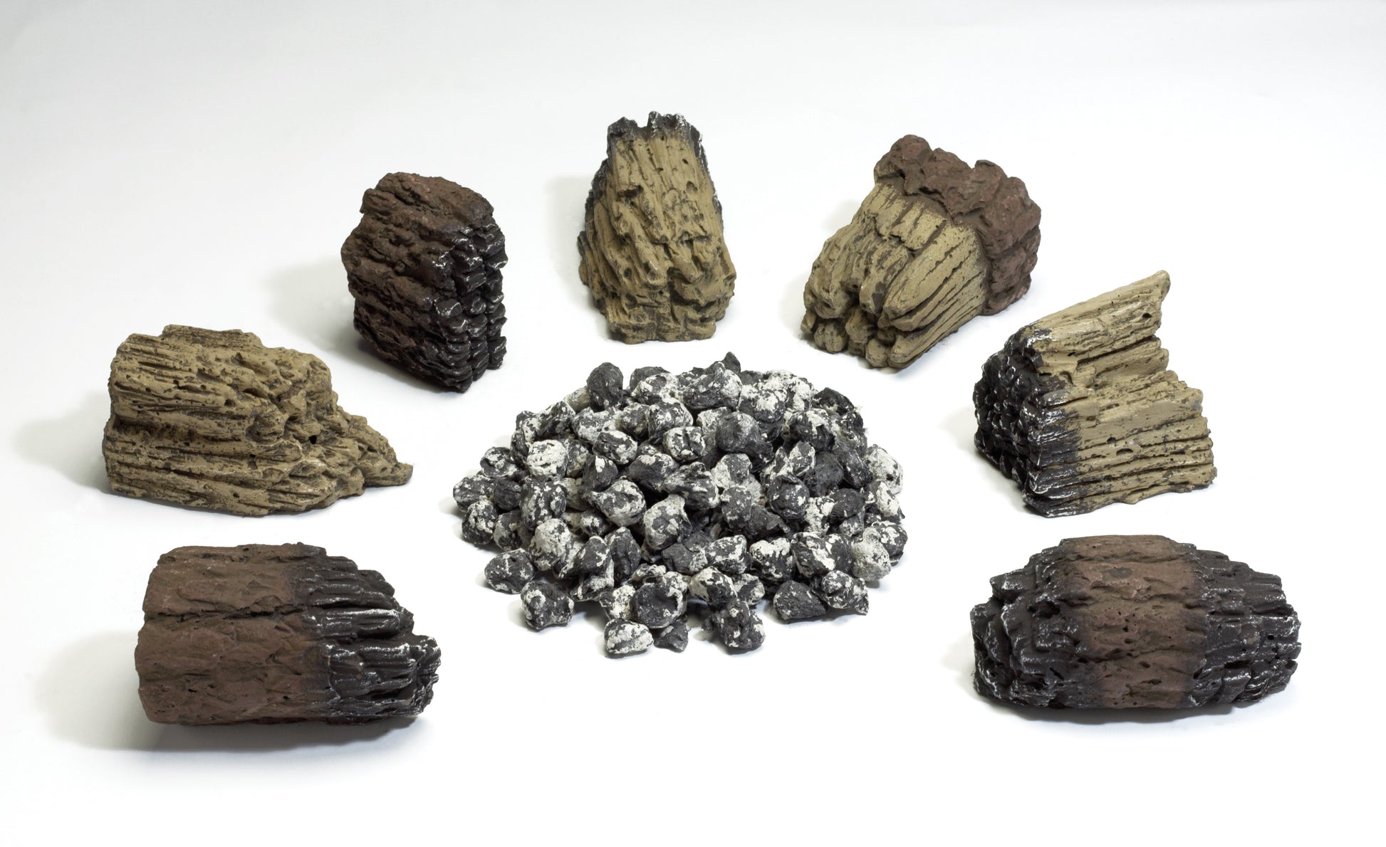 Decorative ember and log set with dark rock pieces and gray stones