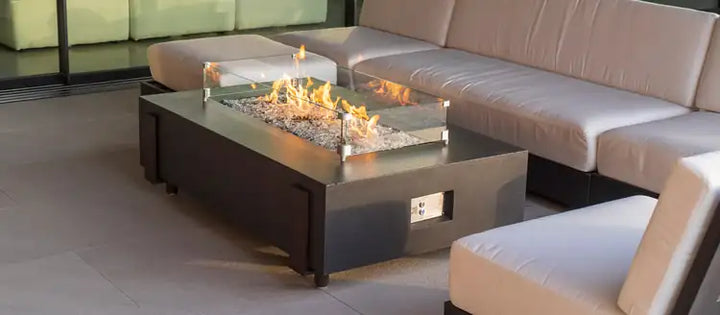 Rectangular fire table with flames in an outdoor living space