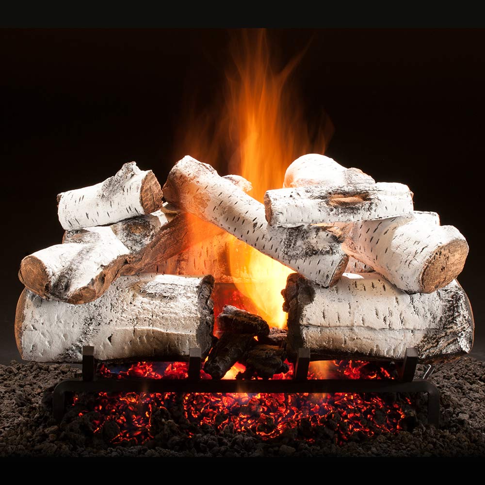 Vented gas log set with stacked white ceramic logs and glowing orange flames