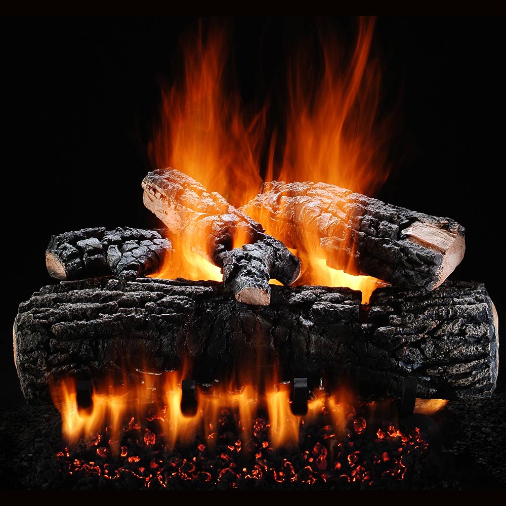 Vented gas logs with burning flames and glowing embers, dark charcoal logs