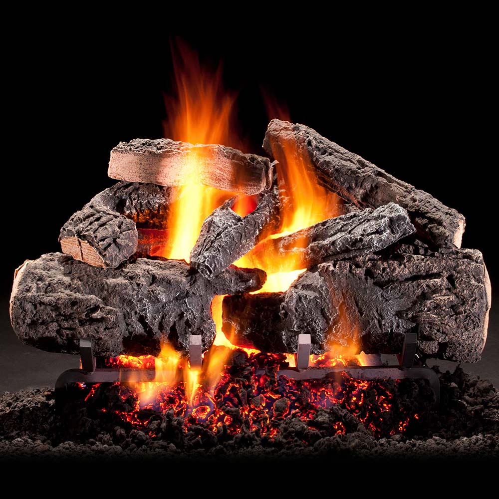 Shallow vented gas log set with glowing flames and faux charred logs