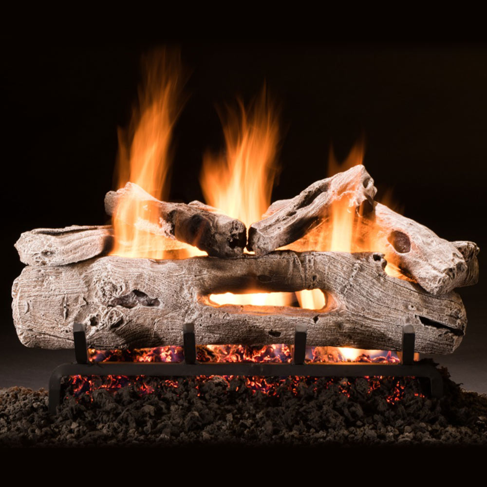 Vented gas log set with driftwood-style logs and visible flames