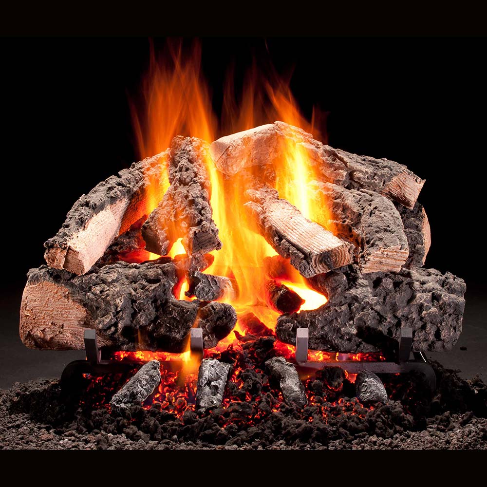 Vented gas log set with burning flames and charred wood pieces